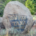 Butte Taxi ad on rock, SE Butte, MT